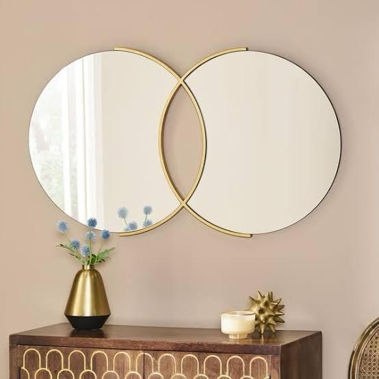 "Modern Overlapping Circle Wall Mirror – Gold Frame Accent"